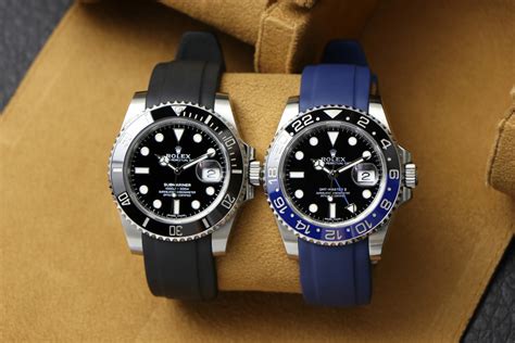 rolex submariner on rubber strap.